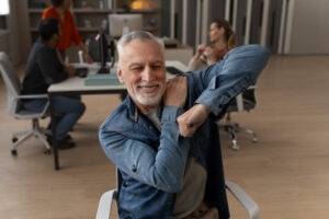 man-office-stretching-work-day